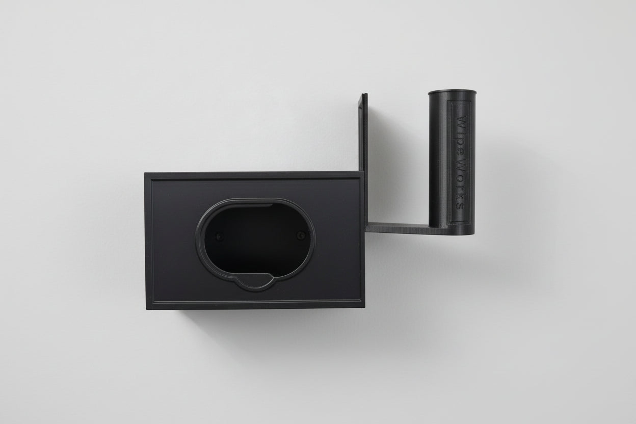 White wall-mounted WipeWorks bathroom dispenser for flushable wipes and toilet paper. demonstrating  wipe refilling.